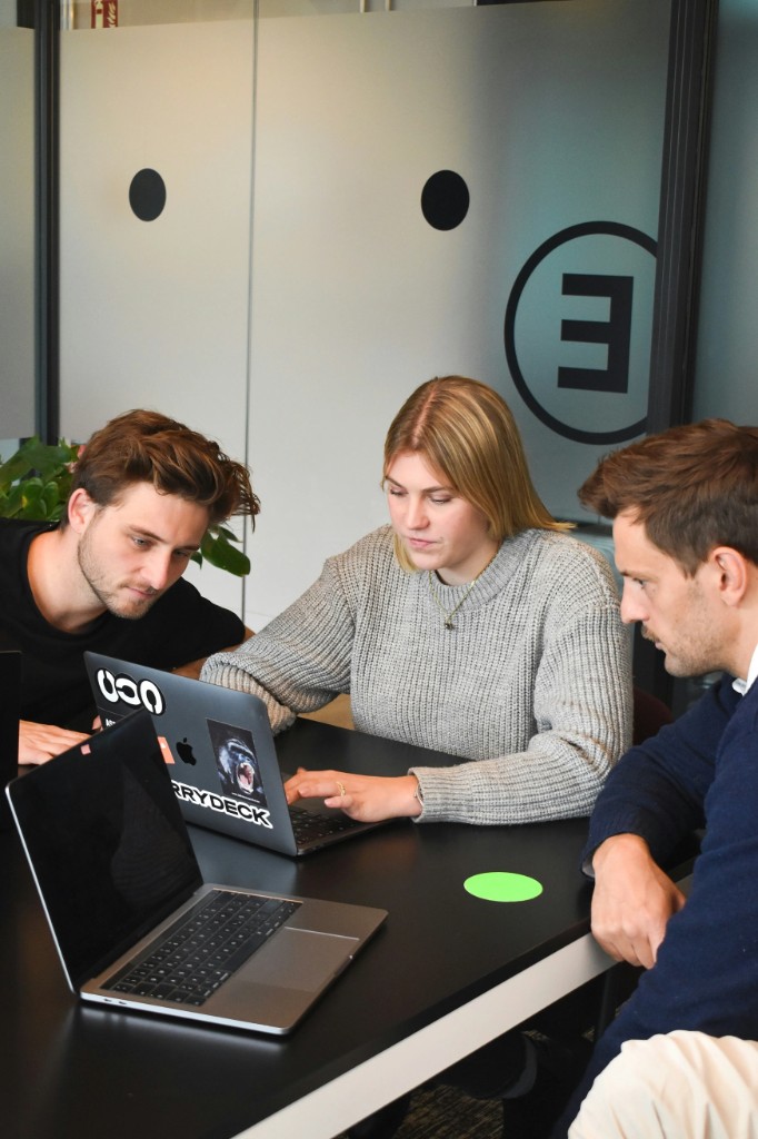 People working around a table in an office